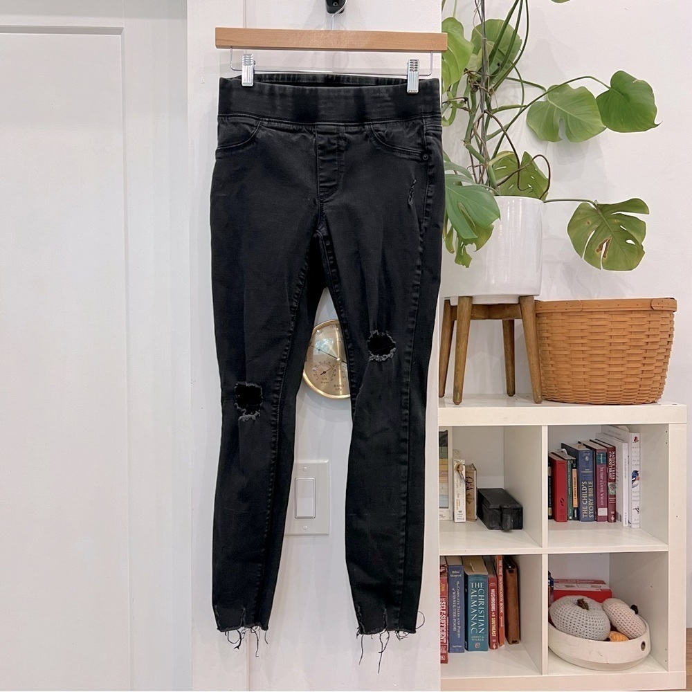 Rockstar black jeans with distressed ankles and elastic waistband